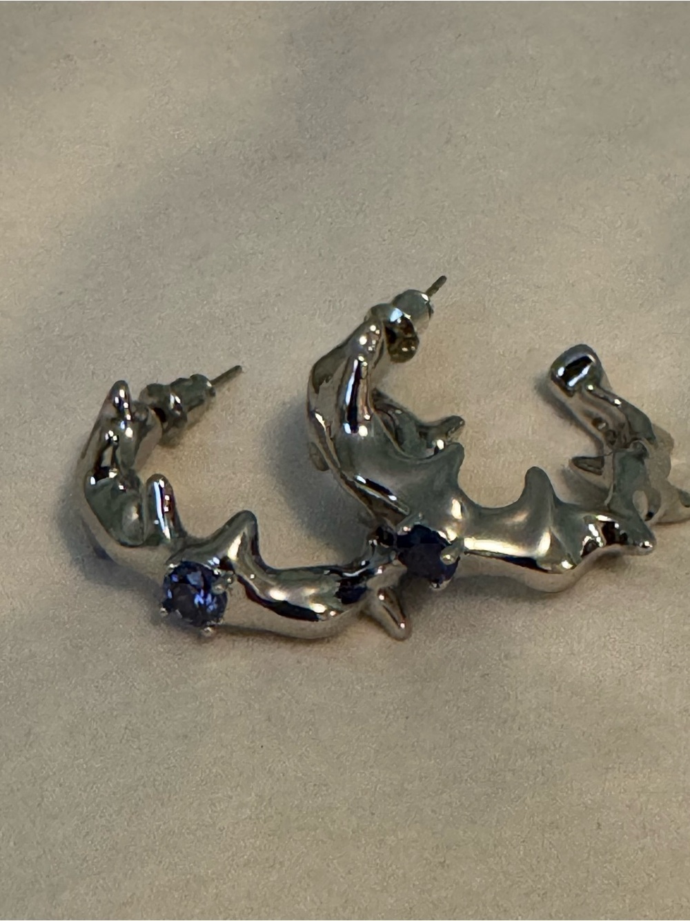 Silver Sculpted Hoop Earrings with Blue Accent Stone